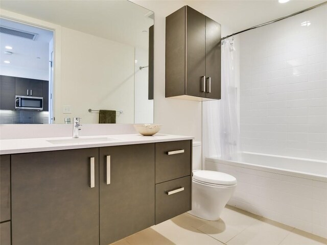222 W Ave Unit 1907, Austin, TX 78701 - bathroom featuring shower / bath combo, vanity, and tile patterned floors