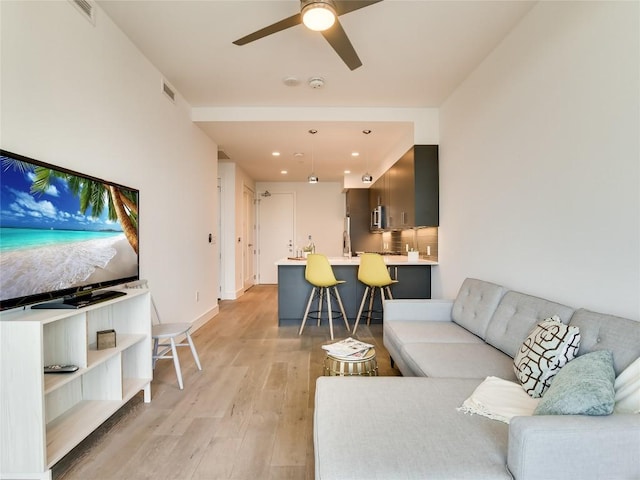 222 W Ave Unit 1907, Austin, TX 78701 - living room featuring light wood finished floors, a ceiling fan, and recessed lighting
