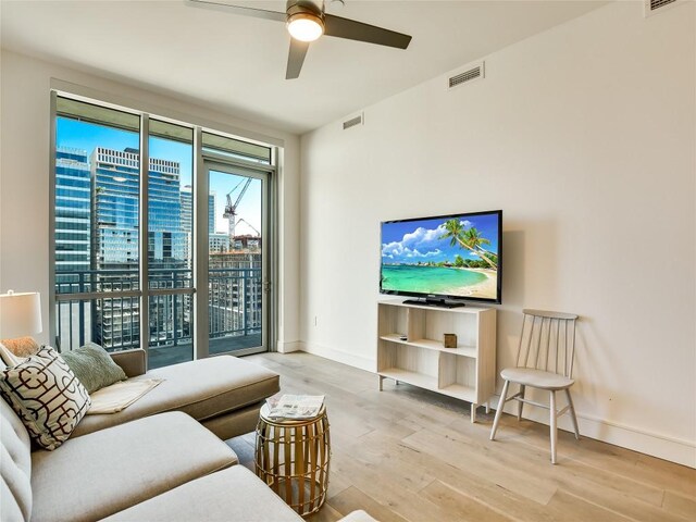 222 W Ave Unit 1907, Austin, TX 78701 - living room featuring wood finished floors and a ceiling fan