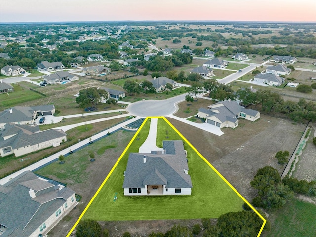 aerial view at dusk with a residential view