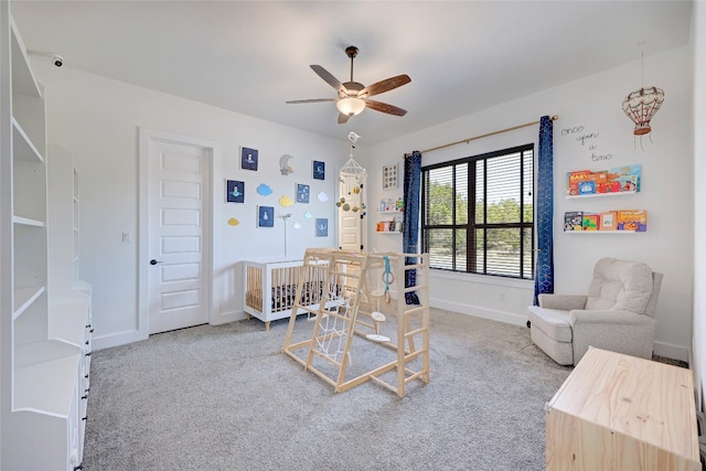 interior space featuring baseboards and ceiling fan