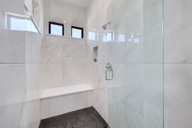 full bath with a shower stall