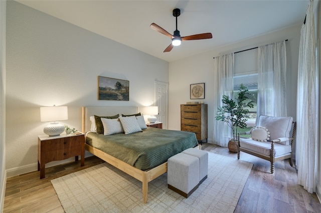 1174 Royal Eagle Dr, Fischer, TX 78623 - bedroom featuring light wood-style floors, baseboards, and a ceiling fan