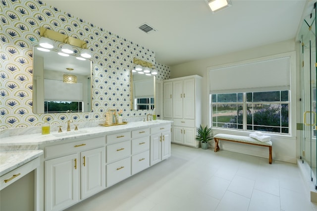 1174 Royal Eagle Dr, Fischer, TX 78623 - full bath with double vanity, wallpapered walls, and baseboards