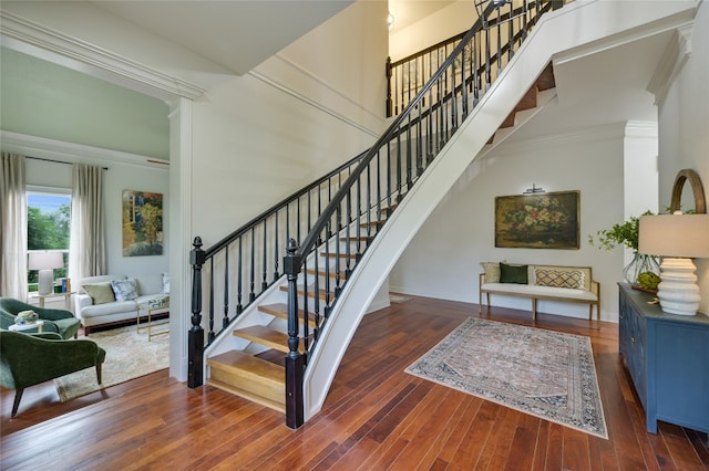1174 Royal Eagle Dr, Fischer, TX 78623 - stairs featuring wood finished floors and ornamental molding