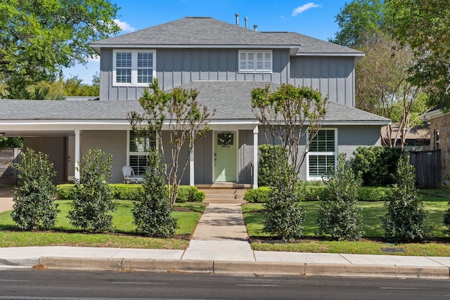 2517 Exposition Blvd, Austin, TX 78703 - view of front of property featuring board and batten siding, brick siding, covered porch, and a shingled roof