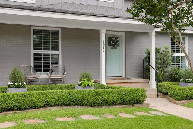2517 Exposition Blvd, Austin, TX 78703 - property entrance with brick siding, a porch, and board and batten siding