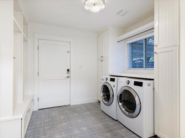 2517 Exposition Blvd, Austin, TX 78703 - washroom with independent washer and dryer, cabinet space, light colored carpet, and baseboards
