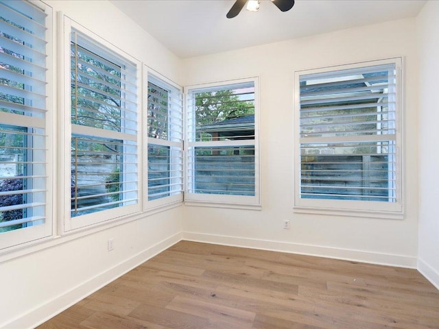 2517 Exposition Blvd, Austin, TX 78703 - spare room with wood finished floors, a ceiling fan, and baseboards