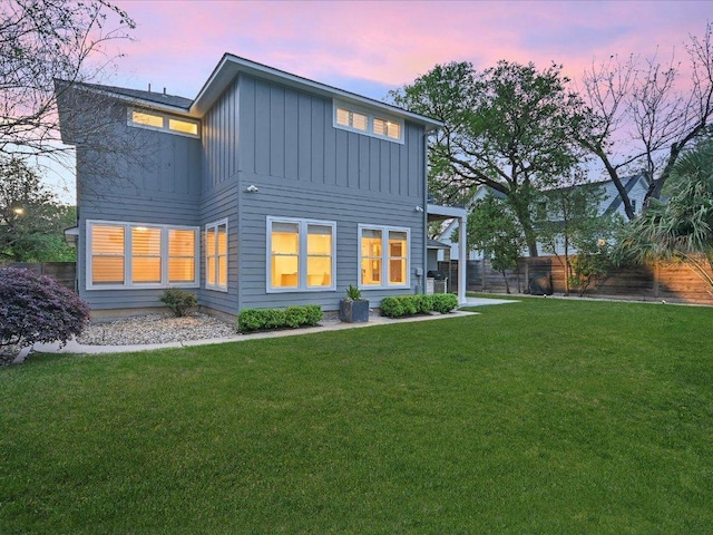 2517 Exposition Blvd, Austin, TX 78703 - back of house at dusk with board and batten siding