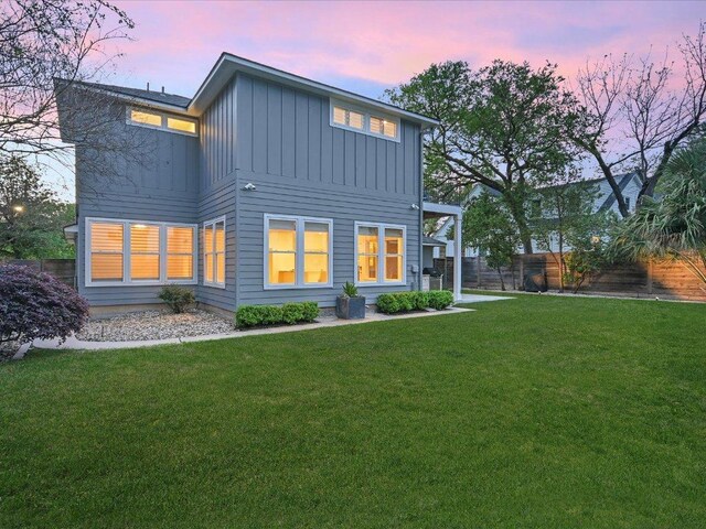 2517 Exposition Blvd, Austin, TX 78703 - back of house at dusk with board and batten siding