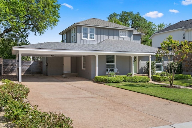 2517 Exposition Blvd, Austin, TX 78703 - view of front of property with a carport, board and batten siding, driveway, a porch, and a shingled roof