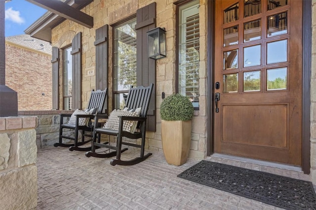 436 Santaluz Path, Austin, TX 78732 - entrance to property featuring covered porch and stone siding