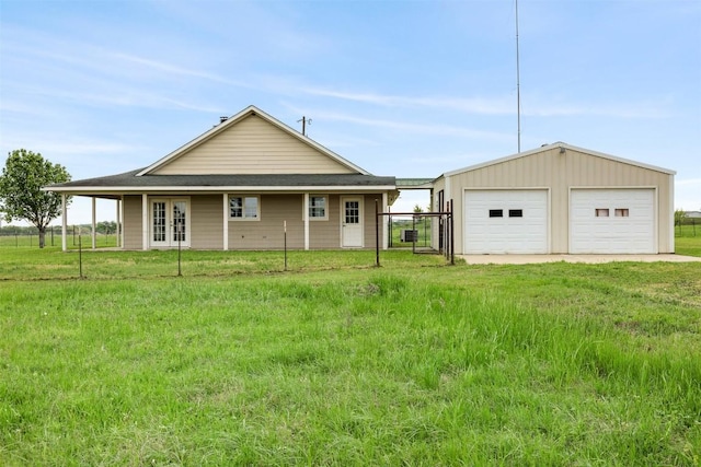 1234 County Road 135, Lincoln, TX 78948 - back of house with a garage and an outbuilding