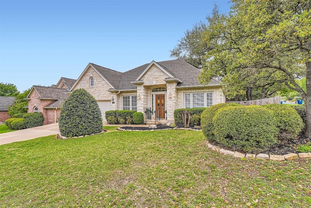 11100 Comiso Pala Path, Austin, TX 78726 - view of front facade featuring stone siding, an attached garage, and driveway