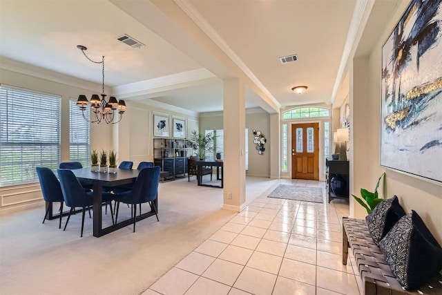 foyer featuring light tile patterned floors, light carpet, a chandelier, and visible vents