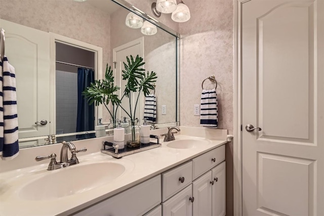 full bathroom with double vanity and a sink