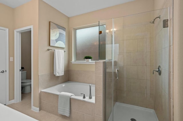 17920 Silent Harbor Loop, Pflugerville, TX 78660 - full bathroom with a garden tub, a shower stall, toilet, and tile patterned flooring