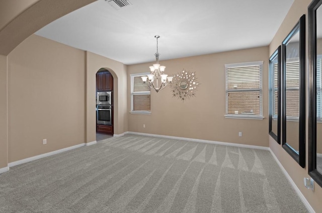 17920 Silent Harbor Loop, Pflugerville, TX 78660 - empty room with arched walkways, carpet flooring, and a chandelier