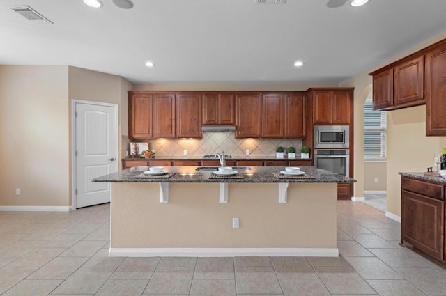 17920 Silent Harbor Loop, Pflugerville, TX 78660 - kitchen with stainless steel appliances, a sink, dark stone countertops, tasteful backsplash, and recessed lighting