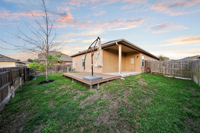 6608 May Shower Dr, Austin, TX 78744 - back of property featuring a wooden deck and central AC