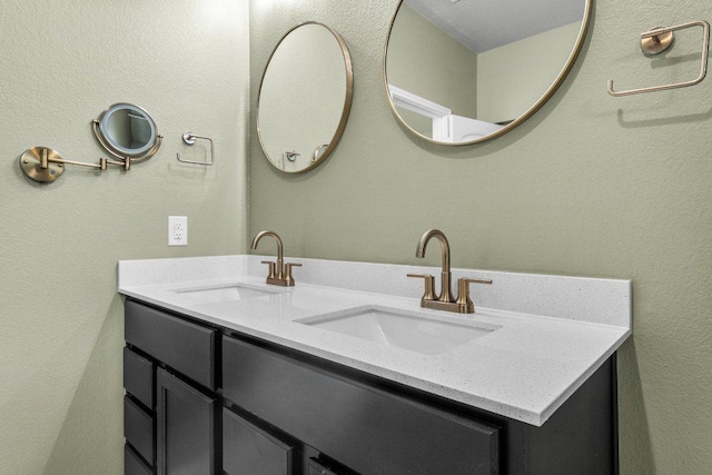 bathroom featuring double vanity and a sink