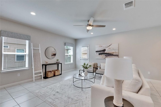 living area featuring tile patterned floors, visible vents, ceiling fan, and recessed lighting