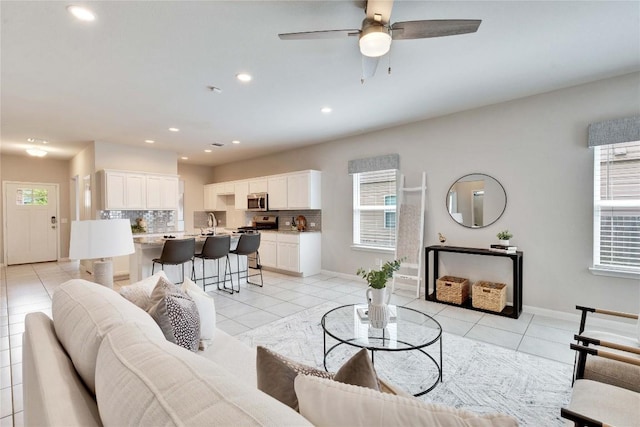 6608 May Shower Dr, Austin, TX 78744 - living area featuring recessed lighting, a ceiling fan, and light tile patterned floors