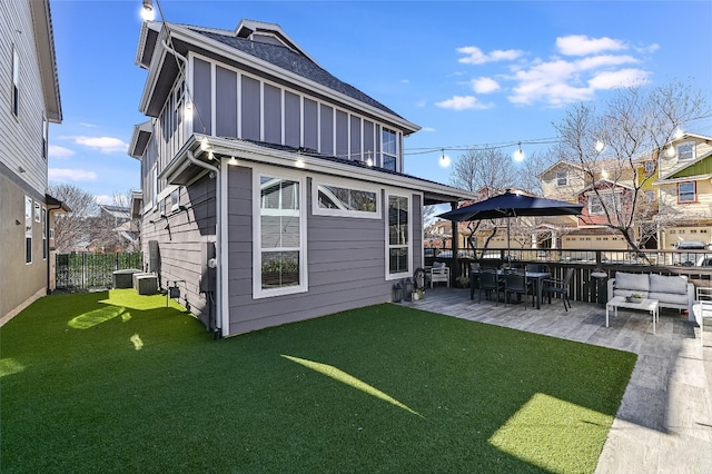 928 Sugaree Ave, Austin, TX 78757 - rear view of property featuring outdoor lounge area, board and batten siding, a patio, a shingled roof, and central AC unit