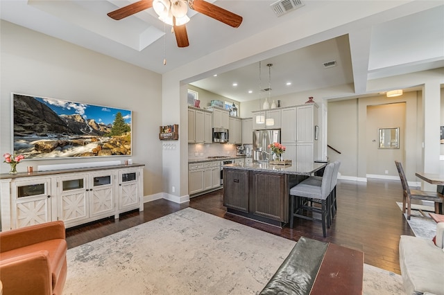 928 Sugaree Ave, Austin, TX 78757 - kitchen featuring stainless steel appliances, dark wood-style floors, baseboards, a ceiling fan, and recessed lighting