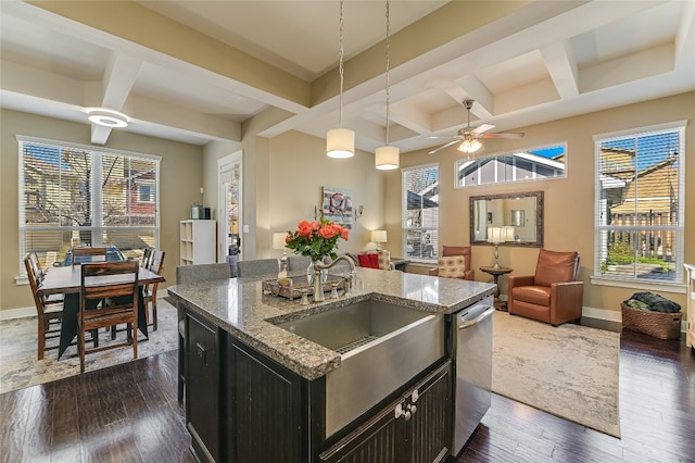 928 Sugaree Ave, Austin, TX 78757 - kitchen with coffered ceiling, ceiling fan, dark cabinetry, stainless steel dishwasher, and dark wood-type flooring
