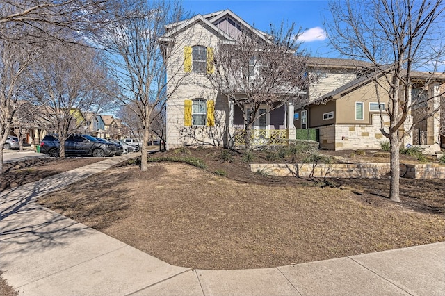 928 Sugaree Ave, Austin, TX 78757 - view of front facade featuring stone siding