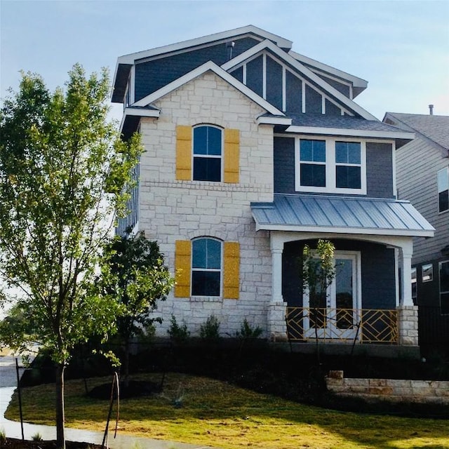 928 Sugaree Ave, Austin, TX 78757 - view of front facade featuring stone siding and metal roof