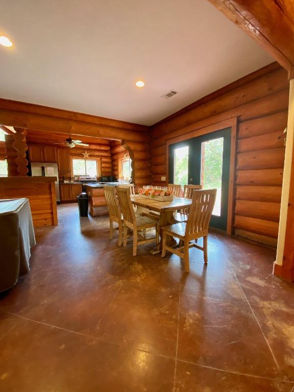 2550 Fm 2342 Hero'S Hideaway, Unit Heros Hideaway, Burnet, TX 78611 - dining room featuring rustic walls, plenty of natural light, and recessed lighting