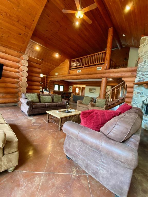 2550 Fm 2342 Hero'S Hideaway, Unit Heros Hideaway, Burnet, TX 78611 - living area with wood ceiling, high vaulted ceiling, log walls, and a ceiling fan