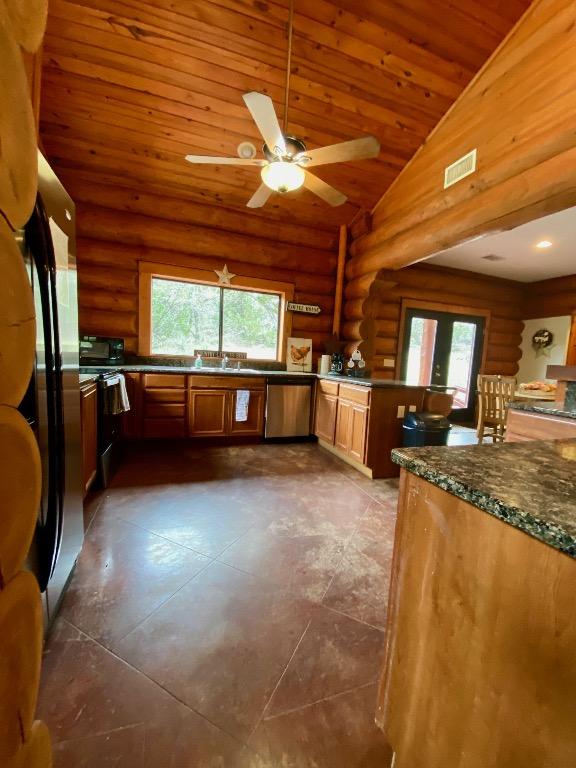 2550 Fm 2342 Hero'S Hideaway, Unit Heros Hideaway, Burnet, TX 78611 - kitchen with log walls, appliances with stainless steel finishes, healthy amount of natural light, wooden ceiling, and ceiling fan