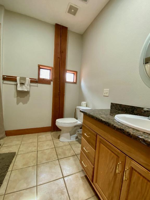2550 Fm 2342 Hero'S Hideaway, Unit Heros Hideaway, Burnet, TX 78611 - bathroom with vanity, tile patterned floors, and lofted ceiling