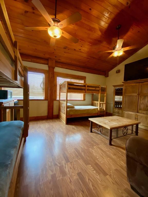 2550 Fm 2342 Hero'S Hideaway, Unit Heros Hideaway, Burnet, TX 78611 - bedroom with wooden ceiling, light wood finished floors, and vaulted ceiling