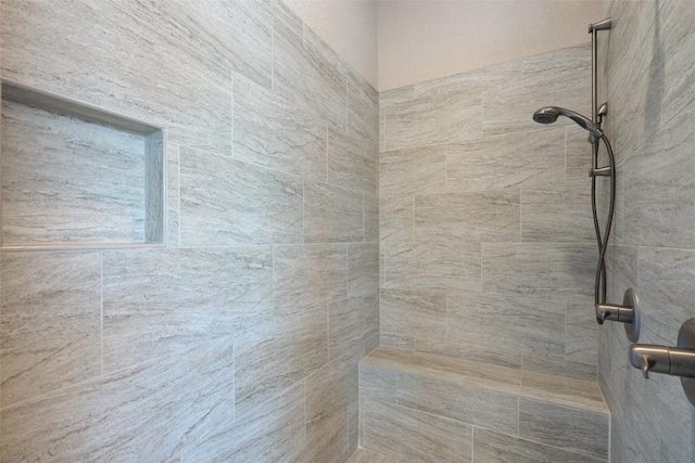 full bathroom with tiled shower