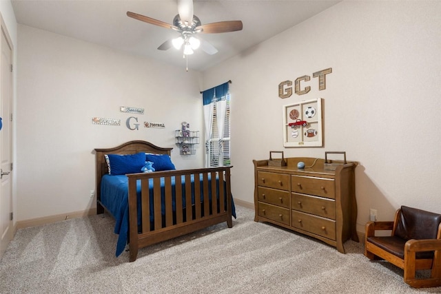 bedroom with carpet flooring, a ceiling fan, and baseboards