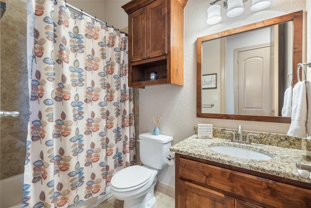 full bath featuring baseboards, toilet, tile patterned floors, vanity, and a textured wall