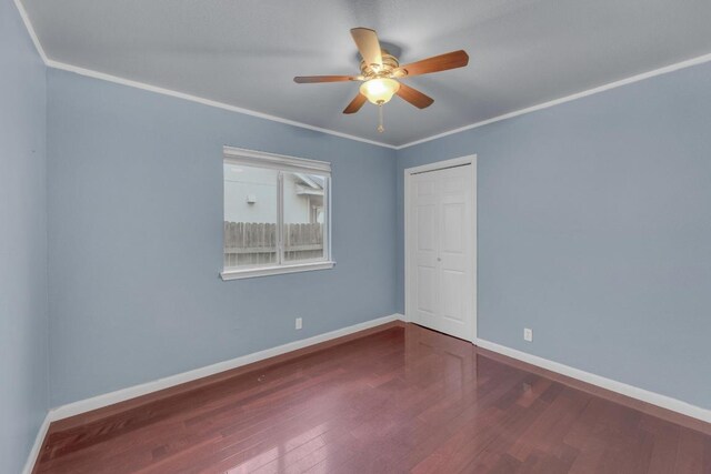 1708 Royal Ascot Dr, Pflugerville, TX 78660 - empty room with baseboards, ceiling fan, wood finished floors, and crown molding