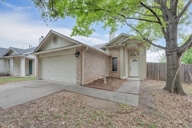1708 Royal Ascot Dr, Pflugerville, TX 78660 - view of front of home with fence, a chimney, a garage, and driveway