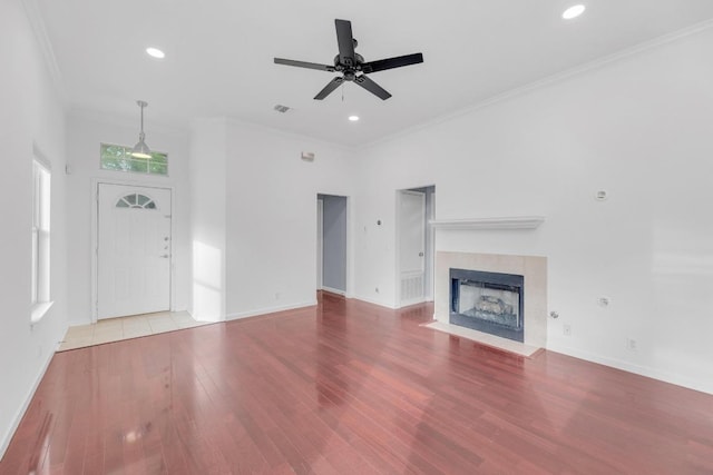 1708 Royal Ascot Dr, Pflugerville, TX 78660 - unfurnished living room featuring baseboards, ceiling fan, wood finished floors, and crown molding