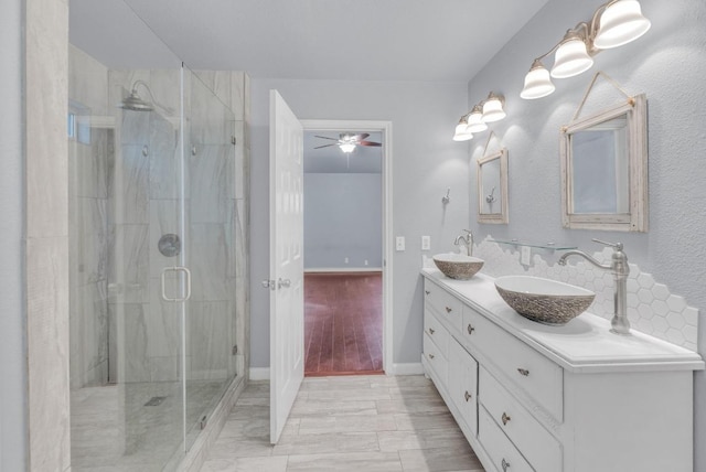 1708 Royal Ascot Dr, Pflugerville, TX 78660 - full bath with a ceiling fan, a sink, a stall shower, and double vanity