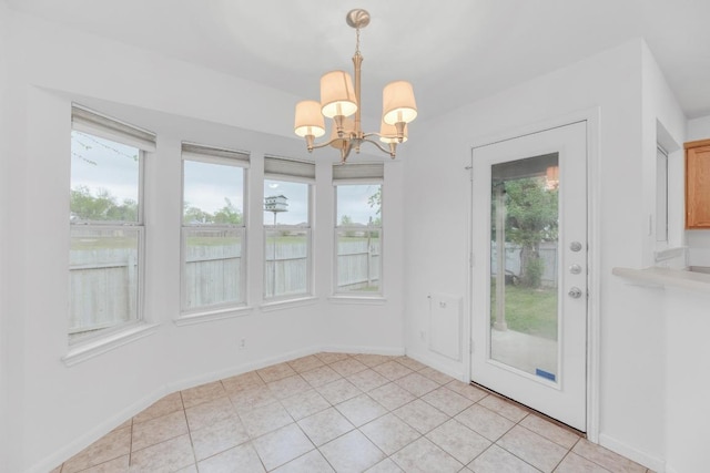 1708 Royal Ascot Dr, Pflugerville, TX 78660 - unfurnished dining area with baseboards, a chandelier, and light tile patterned floors