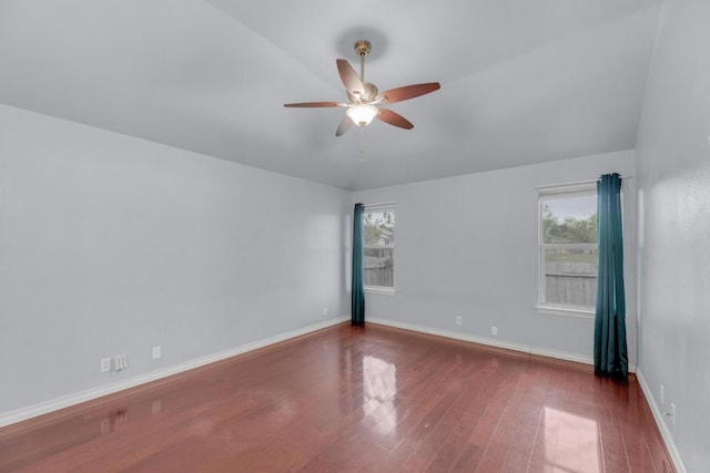 1708 Royal Ascot Dr, Pflugerville, TX 78660 - unfurnished room with baseboards, ceiling fan, wood finished floors, and vaulted ceiling