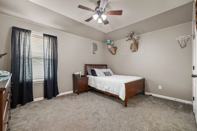 carpeted bedroom with baseboards, lofted ceiling, and ceiling fan