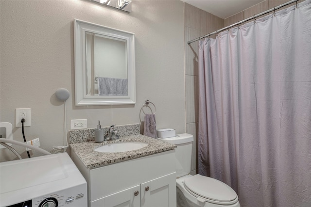 935 La Posada Dr Unit 217, Austin, TX 78752 - full bath featuring washer / clothes dryer, vanity, and a shower with curtain