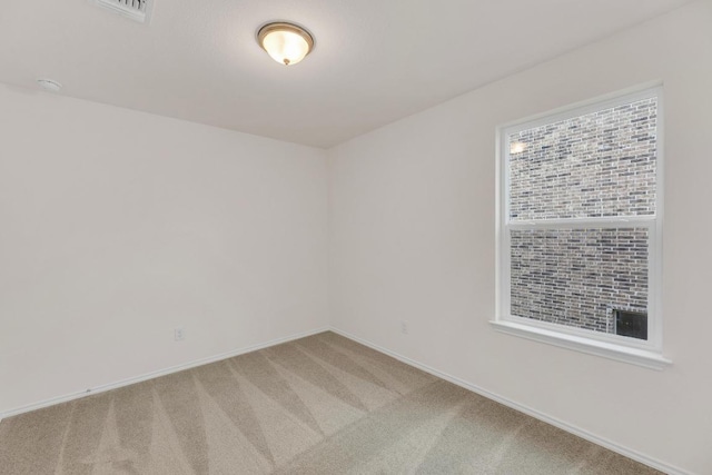 4915 Mozzafiato Ln, Round Rock, TX 78665 - spare room featuring light colored carpet and a smoke detector